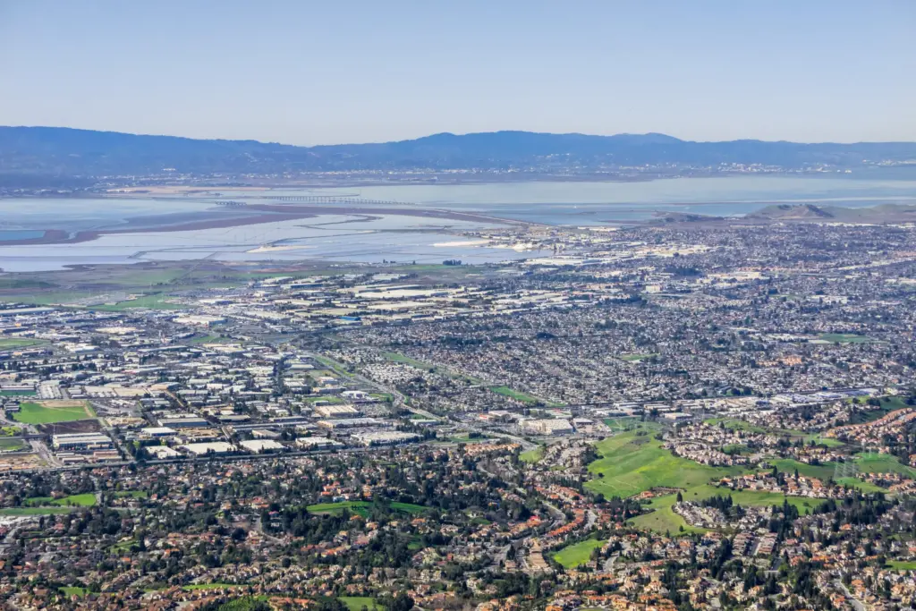 Fremont from the hills: the city, the salt ponds and the Dumbarton Bridge on San Francisco Bay, with the Santa Cruz Mountains beyond