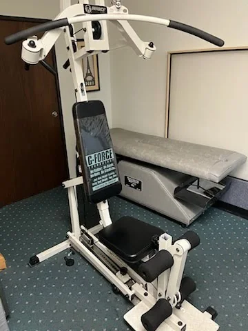 Rehabilitation exercise equipment beside a treatment table